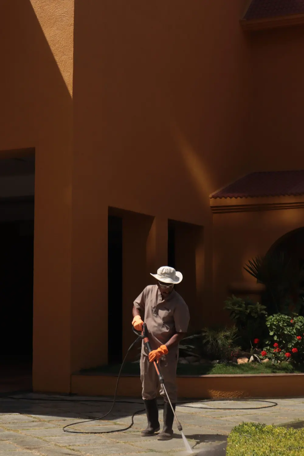 Pressure washing a stone courtyard